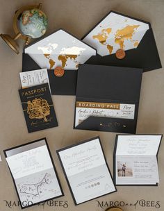 the wedding stationery is laid out on top of each other, including cards and envelopes