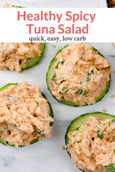 healthy spicy tuna salad in cucumbers on a marble countertop with text overlay