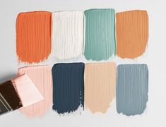 the paint colors are different shades of blue, orange, and pink with a brush