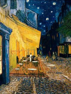 a cross stitch picture of an outdoor cafe at night