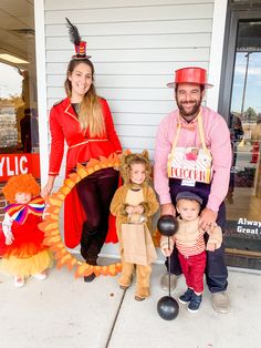 a man, woman and child are dressed up in costumes