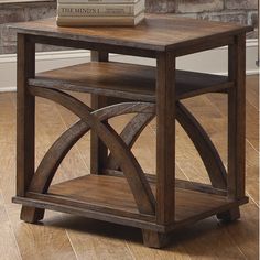 a wooden end table with a book on top