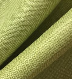 an up close shot of the fabric in light green color, with very thin lines on it