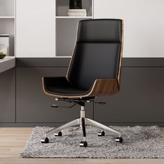 a black office chair sitting on top of a rug