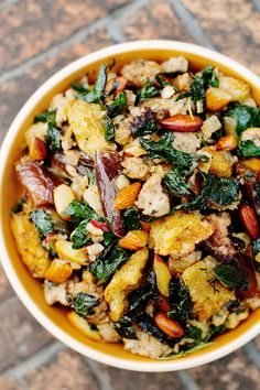 a bowl filled with food sitting on top of a tiled floor