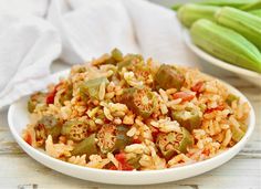 a white bowl filled with rice and vegetables