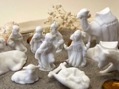 a group of white figurines sitting on top of a table