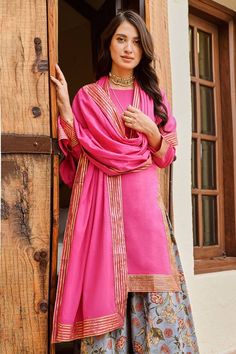 Pink kurta with placement stripe pattern. Paired with a floral print palazzo. Comes along with a dupatta.
Components: 3
Pattern: Print: Palazzo
Type Of Work: Floral
Neckline: Round Neck
Sleeve Type: Three Quarter Sleeves
Fabric: Chanderi, Cotton Mulmul 
Color: Pink
Other Details: 
Stripe border dupatta
Occasion: Sangeet - Aza Fashions Cotton Silk Salwar Kameez For Traditional Ceremonies, Cotton Silk Palazzo Set For Diwali With Traditional Drape, Designer Handloom Salwar Kameez For Navratri, Traditional Drape Cotton Silk Palazzo Set For Diwali, Navratri Designer Handloom Salwar Kameez, Festive Chanderi Handloom Palazzo Set, Designer Handloom Salwar Kameez With Straight Kurta, Traditional Cotton Silk Palazzo Set With Pallu, Designer Handloom Salwar Kameez With Traditional Drape