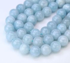 a strand of light blue frosted glass beads