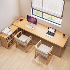 a computer desk with two chairs and a laptop