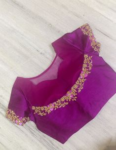 Beautiful deep magenta color pure raw silk blouse with high neck , semi circle net on the back half way through, with gorgeous antique gold embroidered for the neckline, sleeves and back. Cutwirk on the sleeves and front neckline. Size 40 with extra 2 inch margin to open Great for parties, festivals,  weddings or formal dinners You may pair it with any plain saree or textured saree to elevate the beaof this blouse!  DM if you have any questions. Back Net Embroidery Blouse, Plain Net Blouse Designs, Magenta Blouse Designs, Party Blouse With Intricate Embroidery On Chanderi, Party Chanderi Blouse With Intricate Embroidery, Gold Chanderi Blouse With Intricate Embroidery, Party Blouse With Intricate Embroidery In Art Silk, Pink Blouse With Intricate Embroidery For Reception, Pink Chanderi Blouse For Reception