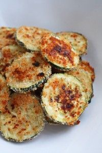 zucchini fritters on a white plate ready to be eaten