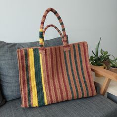 An ideal "Weekender Bag" that is lightweight, colorful and striped.  Whether at the beach or for daily use. It was made from paper yarn.  100% Handmade Dimensions: 35cm*47cm*11cm Brown Hand-knitted Rectangular Bag, Multicolor Jute Crochet Bag For Shopping, Eco-friendly Rectangular Hand-knitted Crochet Bag, Eco-friendly Hand Knitted Rectangular Shoulder Bag, Multicolor Rectangular Crochet Jute Bag, Handwoven Multicolor Rectangular Crochet Bag, Multicolor Rectangular Jute Crochet Bag, Rectangular Hand-knitted Straw Bag For Everyday Use, Rectangular Hand Knitted Straw Bag For Everyday Use