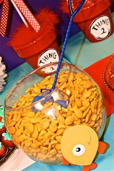 a fish bowl filled with cereal and candy