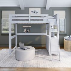 a white loft bed sitting on top of a wooden floor