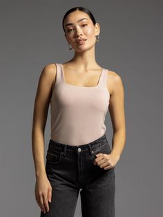 You can never have too many basics in your closet! This double lined tank features a square neck + full length. The fitted silhouette offers versatility for any occasion. Plus, its neutral color makes it perfect for layering under all your favorite jackets + blazers. Fit: True to size Fabric: 88% tencel, 12% spandex Sale styles are final sale. No returns or exchanges. English Rose, English Roses, Fitted Silhouette, Square Necklines, Neutral Color, Square Neckline, Neutral Colors, Square Neck, Blazer Jacket