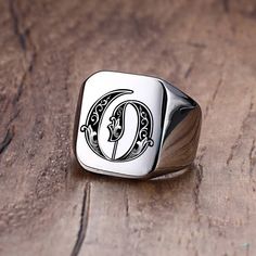 This Custom Old English Initial Signet Ring is a timeless piece of jewelry designed to add personalisation to any look. The classic Old English font brings a classic yet modern touch to any occasion. Customize this ring with your initial letter of choice for a unique, one-of-a-kind look.   SPECIFICATIONS   Surface Width: 18MM  Style: Vintage  Shapepattern: Letter  Metals Type: Stainless Steel  Material: High quality Stainless Steel  Material: Metal  Item Type: Rings  Environmental Standard: Lead Signet Ring For Men, Mens Stainless Steel Rings, Unisex Earrings, Letter Ring, Initial Ring, Ring For Men, Mens Accessories Jewelry, Stainless Steel Rings, Types Of Rings