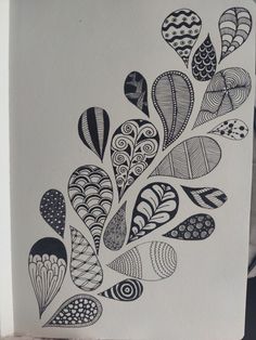 a drawing of many different shapes and sizes on white paper, with black ink in the middle