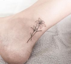 a small flower tattoo on the ankle is one of the most popular tattoos for women