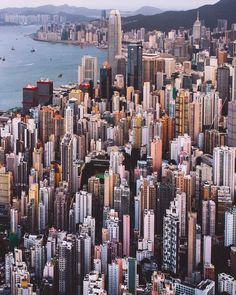 an aerial view of a large city next to the ocean