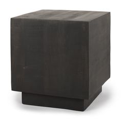 a square wooden object sitting on top of a white surface