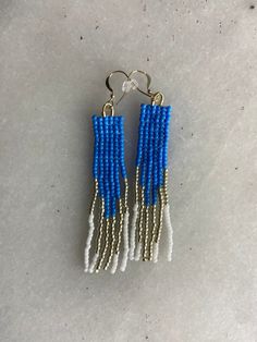 These beautiful beaded earrings are handcrafted with the utmost care in my home in Athens, GA. Surprisingly lightweight and easy to wear for even the most sensitive ears. I hope you love them as much as I loved making them! 1 pictured but listing is for a pair.  Details: * Seed beads * 14 k Gold filled hooks  * Approx.  2 3/4 in long by 0.5 in wide * Weight: 2 grams  * Handmade in Athens, GA, USA Note: The product you receive may differ slightly from the photo due to its handmade nature. Every e Hypoallergenic Blue Beaded Earrings, Blue Colorful Beaded Dangle Earrings, Artsy Blue Beaded Earrings, Blue Faceted Beaded Crystal Earrings, Blue Hand-strung Beaded Earrings, Beautiful Beaded Earring, Blue Morpho Butterfly, Stitch Earrings, Athens Ga