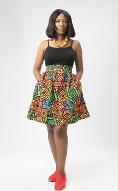 Embrace the boldness and beauty of African fashion with this exquisite skirt that seamlessly blends tradition with modern style. FEATURES: - Main colours: Red/ Yellow/ Black/ Green - Multi-coloured - Comfortable fit - Synched waist/High - Above knee length - A-line skirt - Ankara print/ 100% cotton - wax cotton fabric Spring Knee-length Skirt With Wide Waistband, Green A-line Dress With Lined Skirt, Green A-line Pleated Skirt, Multicolor Lined Wrap Skirt, Multicolor Skirted Dress For Party, Elegant Flared Multicolor Maxi Skirt, Elegant Multicolor Flared Maxi Skirt, Green Dress With Gathered Full Skirt, Green Dress With Gathered Skirt