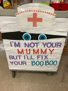 a sign that says i'm not your mummy but i'll fix your booboo