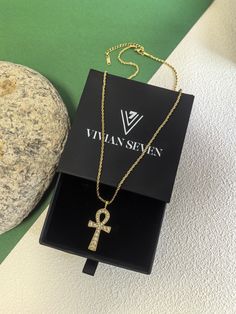 🌟 Indulge in the ultimate luxury with our gold ankh cross pendant necklace. Made with 18k gold plating and a stainless steel rope chain, this necklace exudes elegance and exclusivity. Adorned with shimmering rhinestones, it is the perfect piece of women's jewelry for any sophisticated and stylish ensemble. * Stainless steel chain, titanium steel pendant, rhinestone * 18k gold plate * 20" (50cm) length, 2"(5cm) extender * 1 1/2" (3.7cm) pendant drop * Lobster clasp closure 🌟 Helpful info: Prote Gold Plate Necklace, Ankh Necklace, Ankh Cross, Trendy Necklace, Plate Necklace, Trendy Necklaces, Steel Necklace, Cross Pendant Necklace, Precious Jewelry