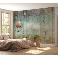 a bedroom scene with a bed, window and hot air balloons in the sky wall mural