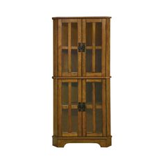 a tall wooden cabinet with glass doors