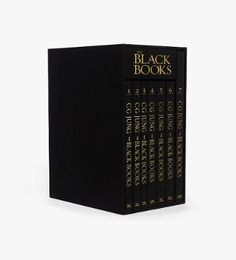 the black books are stacked on top of each other, with gold lettering and numbers