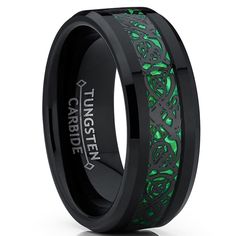 black and green wedding ring with an intricate design