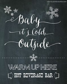 a chalkboard sign that says, baby it's cold outside warm up here hot cocoa bar