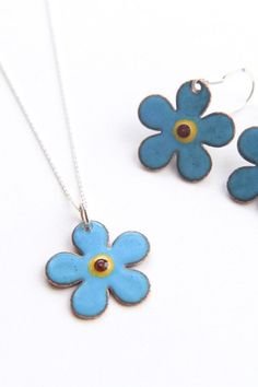 Pretty forget-me-not flower pendant in soft pastel blue enamel with central glass bead. * Flower measures 24mm * Copper is backed with enamel to provide comfort and strength  * Complete with a 925 sterling silver chain * Boxed in an iamrachel branded black box ready for gifting * Each order will vary slightly due to the qualities of enamel  This flower necklace is a beautiful piece of nature jewelry and would make a lovely sentimental gift for a gardener or flower lover. CUSTOMISE: Please contac Blue Hypoallergenic Jewelry For Mother's Day, Blue Sterling Silver Necklace With Flower Charm, Blue Sterling Silver Birth Flower Jewelry, Blue Sterling Silver Jewelry With Birth Flower, Light Blue Flower Shaped Jewelry Gift, Light Blue Flower-shaped Jewelry For Gifts, Blue Flower Charm Necklace As Gift, Blue Flower Pendant Necklace Nickel Free, Blue Flower Shaped Necklace Gift