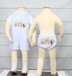 He will look amazing for his Winnie the Pooh Birthday party in a cake smash outfit by Zuli Kids. This Classic birthday diaper cover or cake smash outfit is shown in blue seersucker and can be appliqued with a Classic first birthday design. WHATS INCLUDED One piece blue seersucker diaper cover in your choice of design options. PLEASE NOTE: This listing is for the diaper cover in the first picture only. Matching Sister dress and brother outfit are both sold separately. Coordinating brother and sis White Fitted Sets For Cake Smash, Playful White Sets For Birthday, Fitted White Diaper Cover For First Birthday, Playful White Diaper Cover For First Birthday, Baby Sports Clothes, 1st Birthday Outfit Boy, Baby Girl Thanksgiving Outfit, 1st Birthday Outfit Girl, Baby Girl Thanksgiving