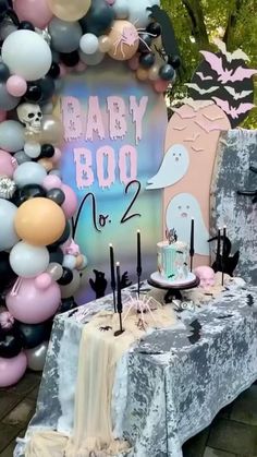 a baby boo birthday party with balloons and decorations