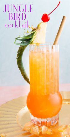 an orange drink with a pineapple garnish on top