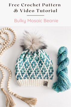 a blue and white knitted hat next to a ball of yarn with the words free crochet pattern and video