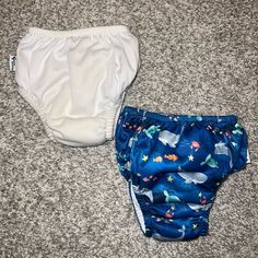 White - Work Twice Blue - Never Worn Size 12 Months Blue Bottoms For Playtime, Machine Washable, Unisex Diaper Cover For Playtime, Playful White Machine Washable Bottoms, Playful White Unisex Bottoms, Playful Unisex White Bottoms, Blue Bottoms For Playwear, Machine Washable, Blue Playwear Bottoms Machine Washable, Playful White Diaper Cover For Playwear, Boys Swim Trunks