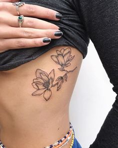 a woman's stomach with flowers on it