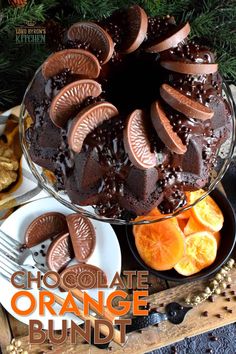 a chocolate cake with orange slices on the side