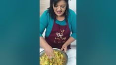 a woman in an apron is cooking food