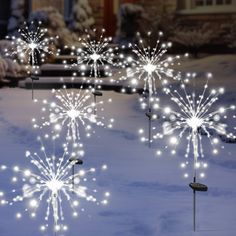 fireworks are lit up in the snow outside