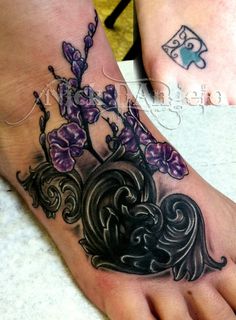 two foot tattoos with flowers and hearts on them