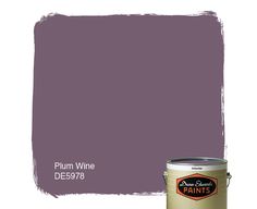 a purple paint with the words plum wine on it and a can of paint next to it