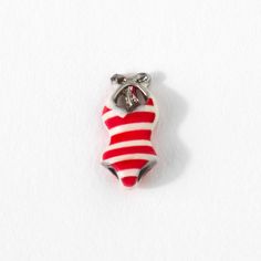 Embrace beach-day fun with our Striped Swimsuit Charm! This playful red and white charm is a nod to sunny days spent lounging on sandy shores, making it a delightful addition for any beach lover’s charm collection. From Miami Beach to Cancun, tell your own story with this adorable charm in your Living Locket®! Living Locket, Sandy Shores, Charm Collection, Striped Swimsuit, Beach Lover, Origami Owl, Beach Lovers, Miami Beach, Cancun