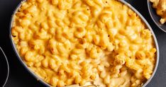 macaroni and cheese in a pan with spoons