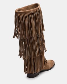 Upgrade your wardrobe with the SPUR fringe boot. These boots feature a fringe detailing that adds a touch of effortless style. Perfect for any occasion, these boots will elevate your look while providing comfort and durability. 1 inch heel height 14.5 inch shaft circumference 15 inch shaft height Suede upper material Synthetic lining Leather sock Synthetic sole Fit tip: If you are in between sizes, size up a half-size Imported Casual Fringe Boots For Fall, Casual Leather Fringe Boots, Leather Fringe Boots For Fall, Casual Suede Fringe Boots, Casual Winter Boots With Fringe, Casual Fringe Winter Boots, Casual Winter Fringe Boots, Winter Fringe Ankle Boots, Winter Suede Boots With Tassels