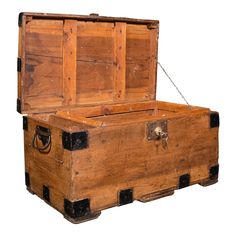 an old wooden trunk with chains hanging from it's sides and the lid open